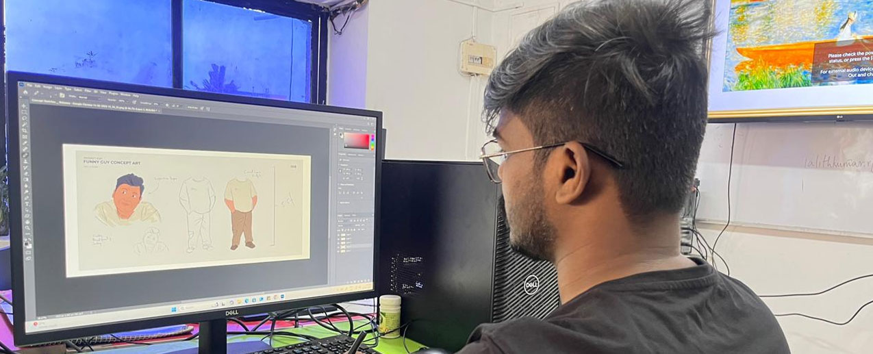 A Boy works on a computer