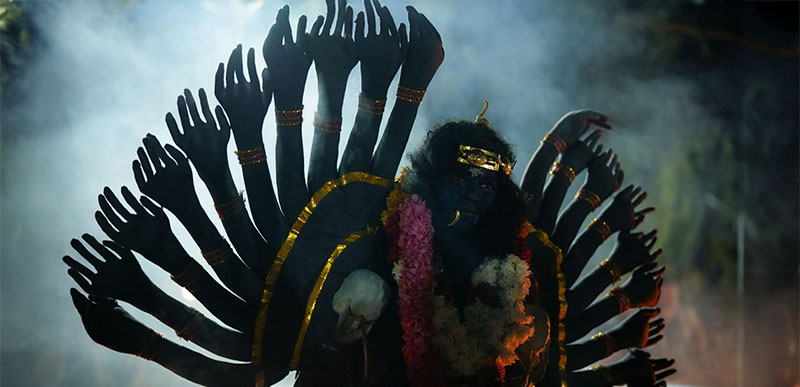 In the shadows of smoke and ritual, mortals become goddesses