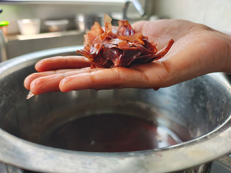 Preparing natural dyes using onion peels.